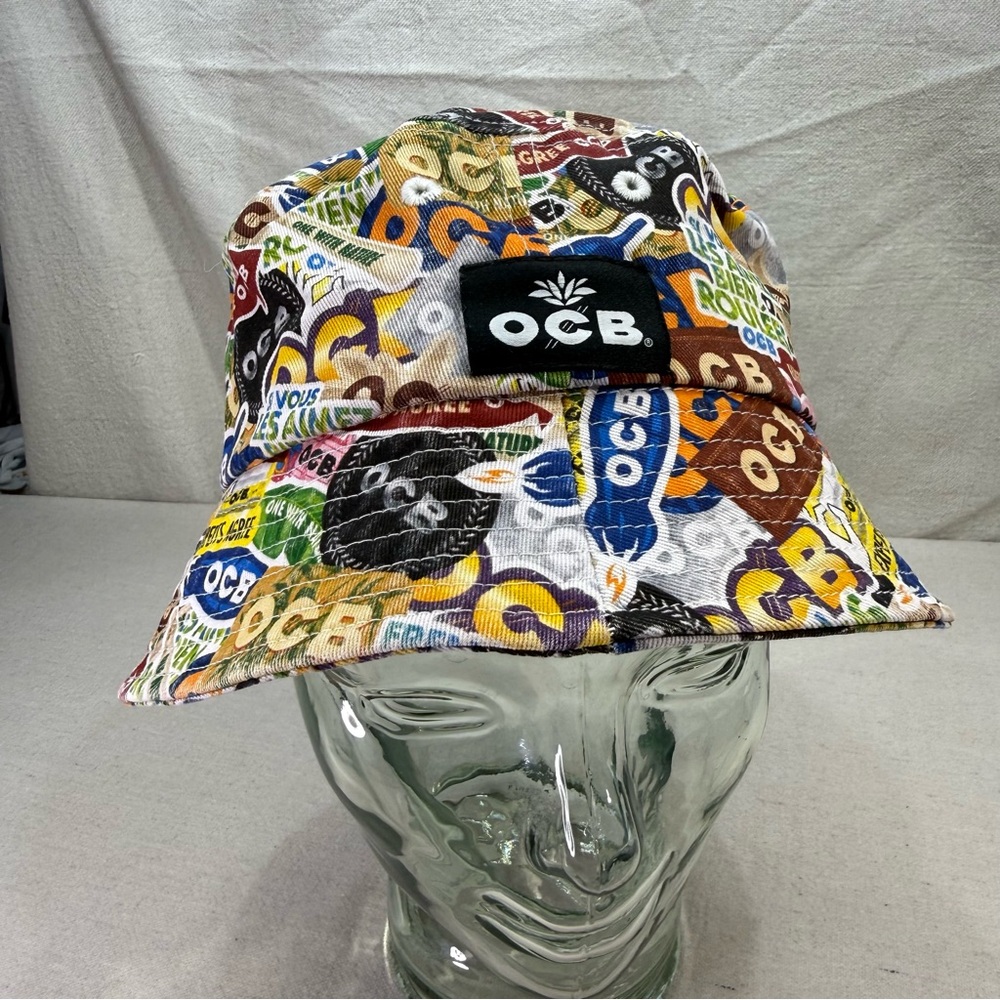 OCB Collage Bucket Hat, featuring an all-over print design of the brand's logo’s